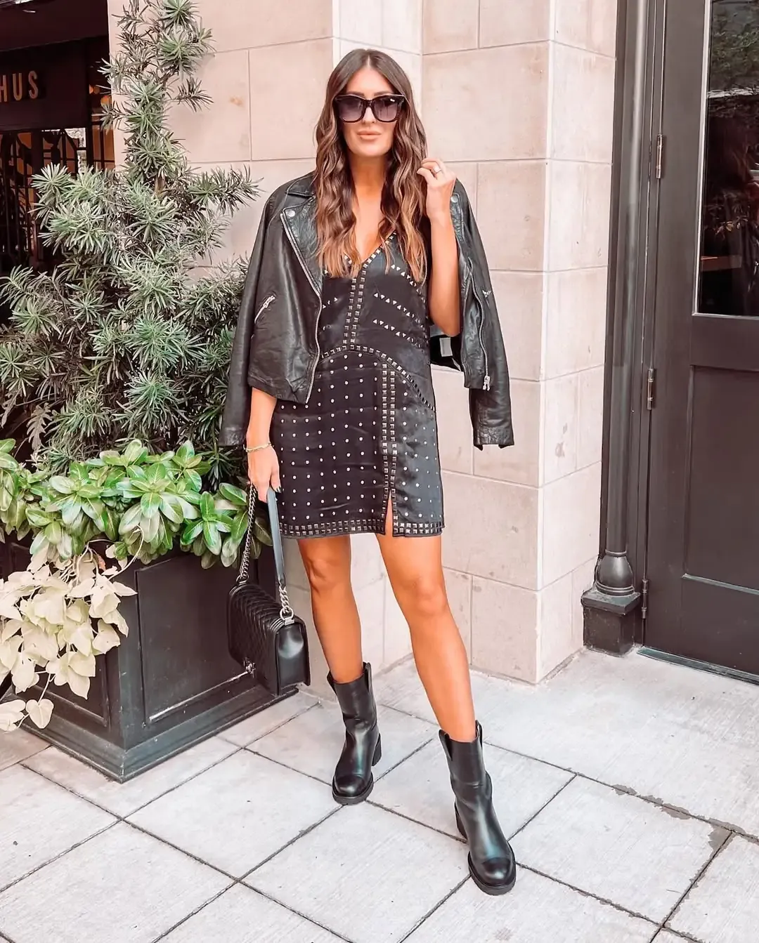 Studded moto jacket over a slip dress