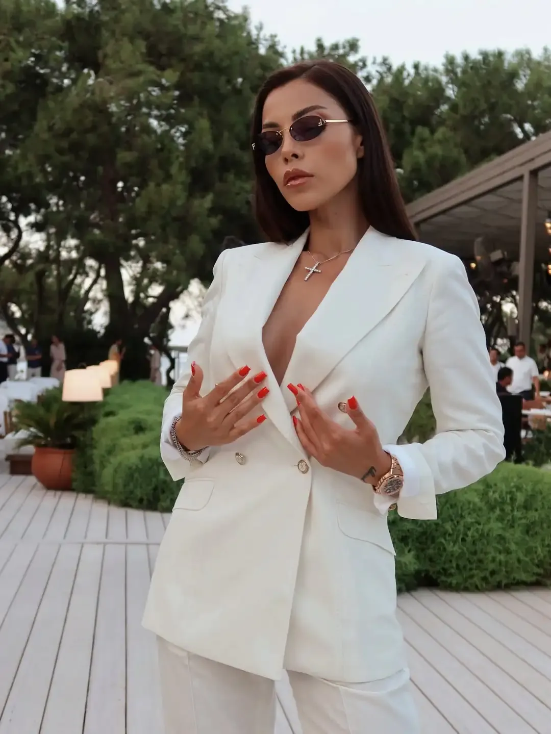 Ivory three-piece suit (blazer, vest, trousers).