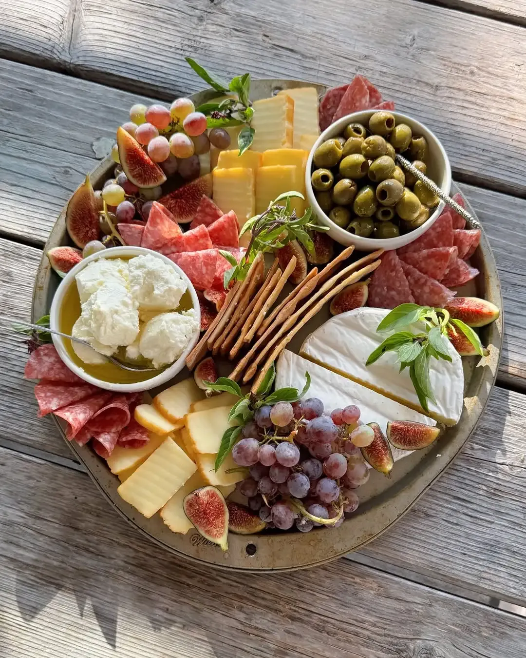 Cheese board with crackers & grapes
