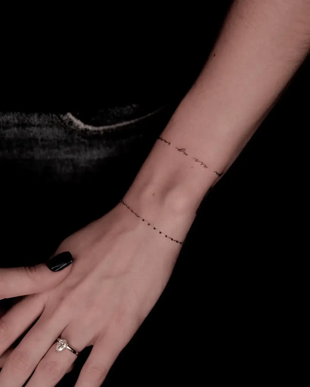 Single-line bracelet tattoo