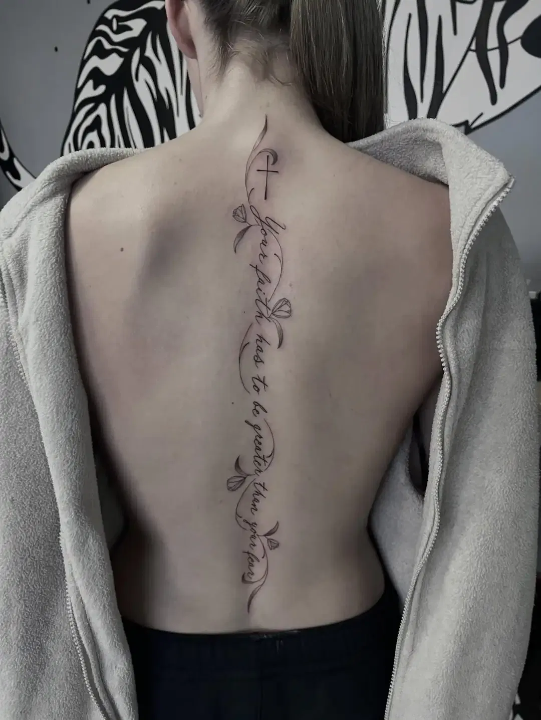Latin Phrase Spine Tattoo