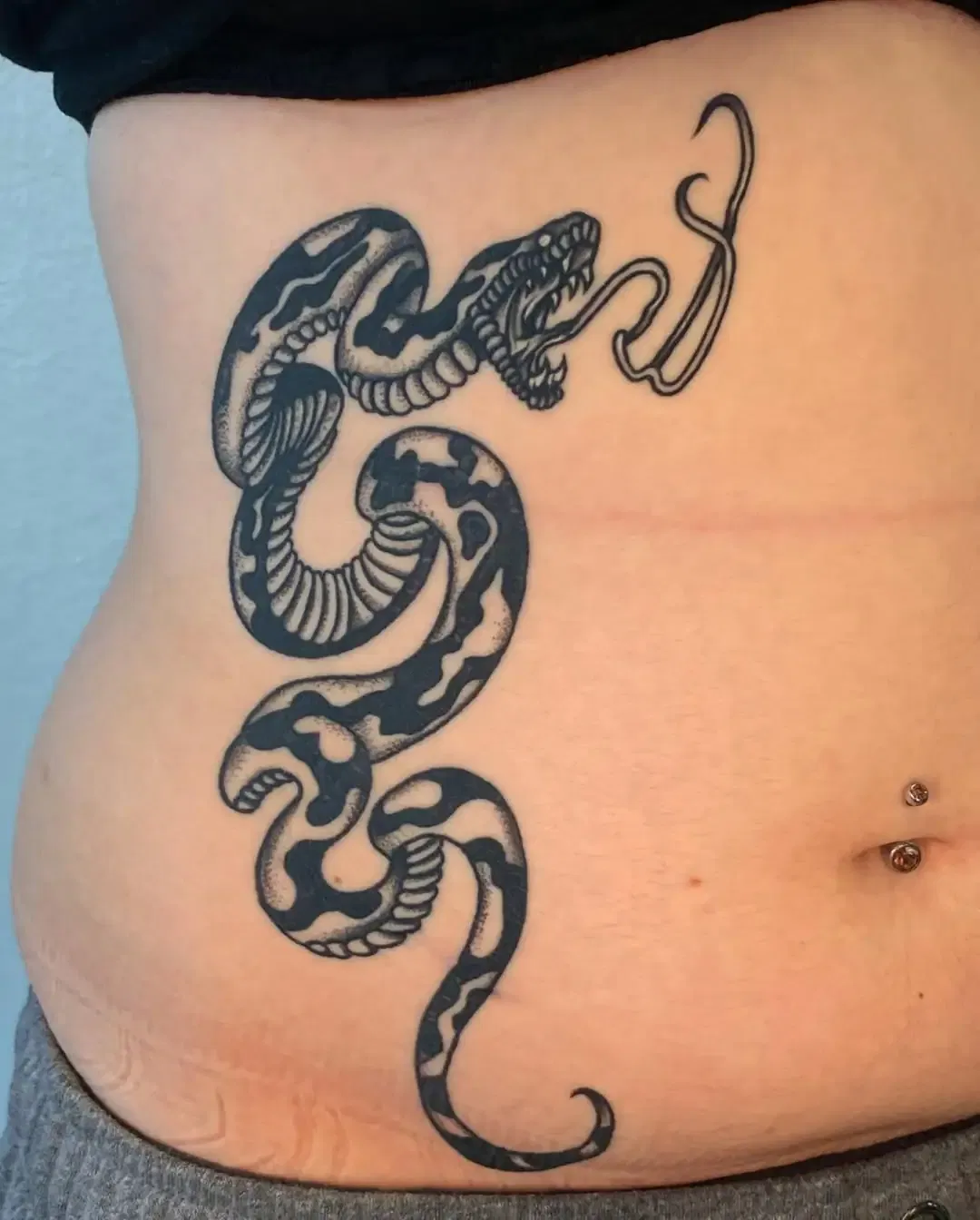 Snake Wrapped Tattoo